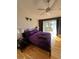 Comfortable main bedroom featuring hardwood floors and balcony at 1010 Strathmore Dr, Orlando, FL 32806