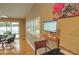 Bright home office space showcasing hardwood floors and a lake view at 1010 Strathmore Dr, Orlando, FL 32806
