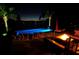 Image features a luxurious pool with stylish lounge seating and ambient lighting at 1010 Strathmore Dr, Orlando, FL 32806