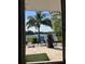 Scenic water view from the patio with comfortable seating and lush greenery at 1010 Strathmore Dr, Orlando, FL 32806