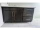 Dark brown vanity with quartz countertop and silver hardware at 1181 Basalt Ln, Sanford, FL 32771