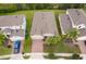 An aerial view of a cozy home with well manicured yard and neighborhood at 886 Grazie Loop, Davenport, FL 33837