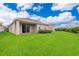 Large backyard with lush green grass at 886 Grazie Loop, Davenport, FL 33837