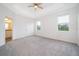 Bright bedroom with plush carpeting and ensuite bathroom access at 886 Grazie Loop, Davenport, FL 33837