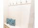 White bench with storage and decorative pillows at 886 Grazie Loop, Davenport, FL 33837