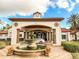 Community center entrance with fountain and covered entryway at 886 Grazie Loop, Davenport, FL 33837