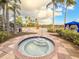 Community hot tub with surrounding tile at 886 Grazie Loop, Davenport, FL 33837