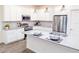 Modern kitchen with stainless steel appliances and island at 886 Grazie Loop, Davenport, FL 33837