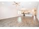 Open concept living room with kitchen and tile floors at 886 Grazie Loop, Davenport, FL 33837