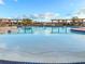 A community swimming pool with seating around the perimeter at 886 Grazie Loop, Davenport, FL 33837