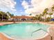 Inviting community pool with lounge chairs at 886 Grazie Loop, Davenport, FL 33837