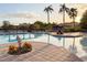 Resort-style pool with a sandy bottom and patio at 886 Grazie Loop, Davenport, FL 33837