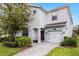 Charming two-story home featuring a one car garage, brick walkway, and well-maintained landscaping at 1638 Moon Valley Dr, Davenport, FL 33896