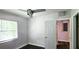 Bedroom with ceiling fan and access to another room at 3408 Lewis Ct, Orlando, FL 32805