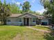Charming one-story home with a well-maintained lawn at 3408 Lewis Ct, Orlando, FL 32805