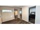 Open living area with new flooring and access to kitchen at 3408 Lewis Ct, Orlando, FL 32805
