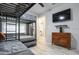 Modern bedroom with gray walls, whitewashed wood floors, and triple bunkbeds at 10544 Wyndcliff Dr, Orlando, FL 32817