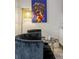 Charming sitting area with black chairs, accent table, modern art, and stylish lamp at 10544 Wyndcliff Dr, Orlando, FL 32817