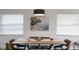 Contemporary dining area with modern lighting, sleek furniture, and stylish wall art at 10544 Wyndcliff Dr, Orlando, FL 32817