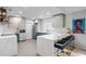 Modern kitchen with stainless steel appliances, breakfast bar, and blue and white accents at 10544 Wyndcliff Dr, Orlando, FL 32817