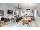 Bright open-concept living and dining area with modern furnishings and light wood floors at 10544 Wyndcliff Dr, Orlando, FL 32817