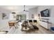 Open-concept living area with modern design, high ceilings, and access to the patio at 10544 Wyndcliff Dr, Orlando, FL 32817