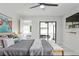 Spacious main bedroom featuring ceiling fan, and access to an outdoor patio at 10544 Wyndcliff Dr, Orlando, FL 32817