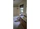 Clean bathroom with single sink vanity and bathtub at 2661 Waccassa St, Geneva, FL 32732