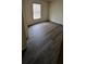 Bedroom with dark laminate flooring and window coverings at 2661 Waccassa St, Geneva, FL 32732