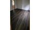 Bright bedroom featuring dark laminate flooring at 2661 Waccassa St, Geneva, FL 32732