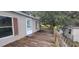 Wooden deck runs along side of manufactured home at 2661 Waccassa St, Geneva, FL 32732
