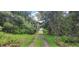 Long driveway leading to property at 2661 Waccassa St, Geneva, FL 32732