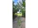 Gravel driveway leading to a grassy field at 2661 Waccassa St, Geneva, FL 32732