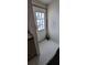 Small entry area with decorative glass door and broom at 2661 Waccassa St, Geneva, FL 32732