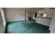 Large open living room area with connecting kitchen in neutral tones at 2661 Waccassa St, Geneva, FL 32732