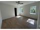Bright and airy bedroom with wood-look tile flooring and white trim at 282 Kimble Ave, Oviedo, FL 32765
