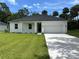 Lovely single-story home with a pristine lawn and a spacious two-car garage at 282 Kimble Ave, Oviedo, FL 32765