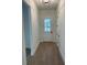 Foyer with wood-look tile flooring and white trim at 282 Kimble Ave, Oviedo, FL 32765