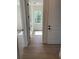 Hallway with white doors, trim and wood-look tile flooring at 282 Kimble Ave, Oviedo, FL 32765