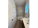 Bathroom featuring white subway tile, a white tub, and black fixtures at 292 Kimble Ave, Oviedo, FL 32765