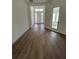 Hallway entrance with white walls, dark flooring, and lots of natural light at 292 Kimble Ave, Oviedo, FL 32765
