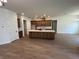 Spacious open kitchen featuring stainless steel appliances, a large island with sink, and tile floors at 292 Kimble Ave, Oviedo, FL 32765