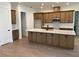 Open concept kitchen featuring stainless steel appliances, a large island, and plenty of cabinet space at 292 Kimble Ave, Oviedo, FL 32765