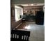 Bright dining area with light-colored tile floors and accent wall with a window at 1149 Holden Ave, Orlando, FL 32839