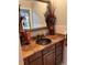 Bathroom features a copper colored granite countertop and decorative brown-toned fixtures at 3336 Edgecliffe Dr, Orlando, FL 32806