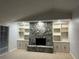 Living room boasts a stone fireplace with built-in shelves and cabinets, complemented by neutral tones at 3336 Edgecliffe Dr, Orlando, FL 32806