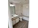 Clean bathroom, featuring a tub and wood-look floors at 4105 Tropical Isle Blvd # 238, Kissimmee, FL 34741