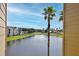 Scenic view of a lake and lush landscape from balcony at 4105 Tropical Isle Blvd # 238, Kissimmee, FL 34741