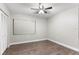 Bedroom with wood-look floors and ceiling fan at 4803 S Texas Ave # B, Orlando, FL 32839