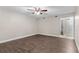 Simple bedroom with wood-look floors and ceiling fan at 4803 S Texas Ave # B, Orlando, FL 32839